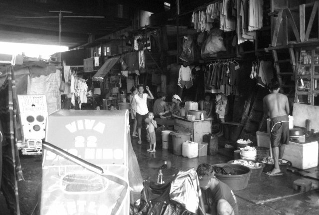 Under the Del Pan bridge are scores of households, which are too poor to legally build decent houses but determined to decently cope with the grinding poverty.